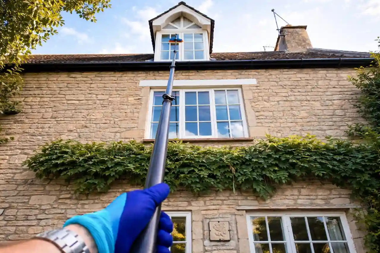 Window Cleaning in San Clemente using a telescopic pole on high dormer windows.