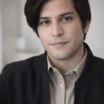 Young man smiling, featured as a customer review for San Clemente Window Cleaning.