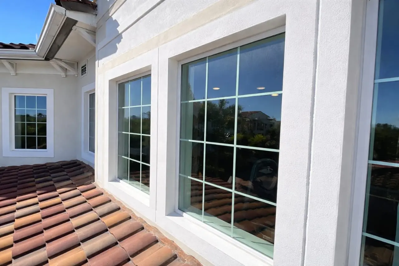 Clean upper floor windows of a Mediterranean-style house in San Clemente.
