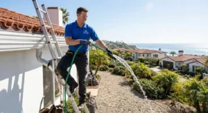 Downspout flushing during gutter cleaning in San Clemente